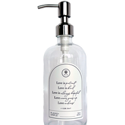 Clear glass Love Is... multipurpose Gratitude Bottle with silver pump.