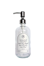 Clear glass Love Is... multipurpose Gratitude Bottle with silver pump.