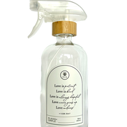 Clear glass Love Is... multipurpose Gratitude Bottle with spray pump.