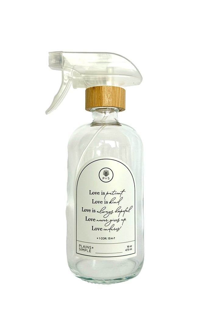 Clear glass Love Is... multipurpose Gratitude Bottle with spray pump.