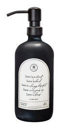 Black glass Love Is... multipurpose Gratitude Bottle with black pump.