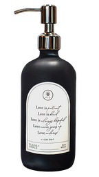 Black glass Love Is... multipurpose Gratitude Bottle with silver pump.