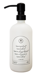White glass Love Is... multipurpose Gratitude Bottle with black pump.