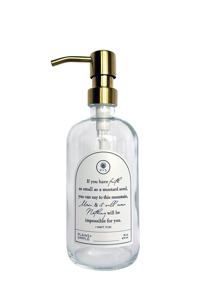 Clear glass Mustard Seed multipurpose Gratitude Bottle with gold pump.