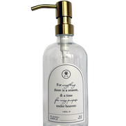 Clear glass Seasons multipurpose Gratitude Bottle with gold pump.