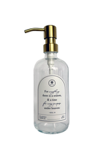 Clear glass Seasons multipurpose Gratitude Bottle with gold pump.