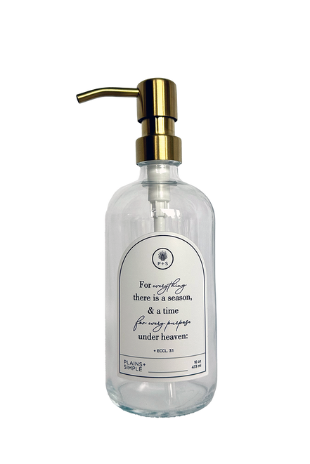 Clear glass Seasons multipurpose Gratitude Bottle with gold pump.