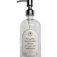 Clear glass Seasons multipurpose Gratitude Bottle with silver pump.