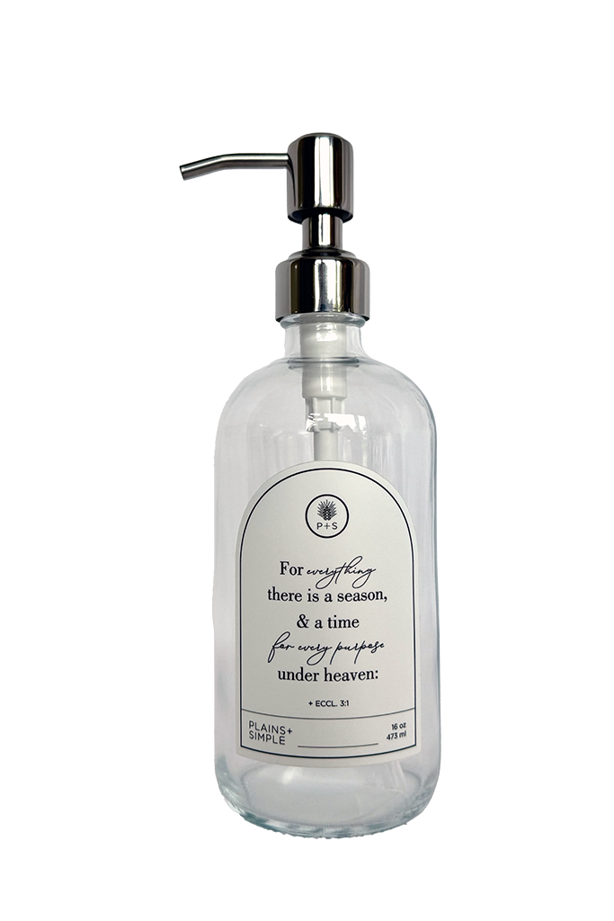 Clear glass Seasons multipurpose Gratitude Bottle with silver pump.