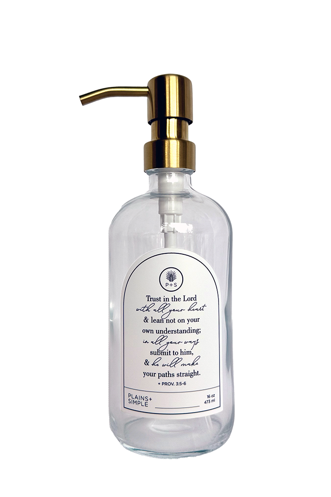 Clear glass Trust multipurpose Gratitude Bottle with gold pump.