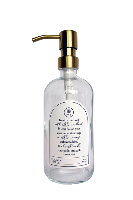 Clear glass Trust multipurpose Gratitude Bottle with gold pump.