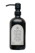 Black glass Trust multipurpose Gratitude Bottle with black pump.