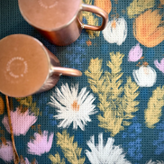 Copper mugs drying near the sink on the Wildflower multipurpose towel.