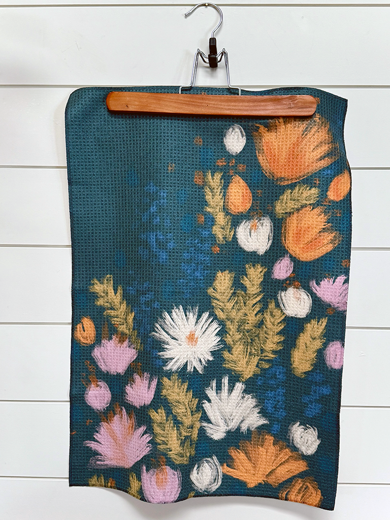 Full view of the colorful Wildflower multipurpose towel designed from verse Luke 12:27-31.